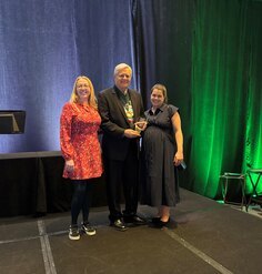 LAF staff present award to Ken Brooks