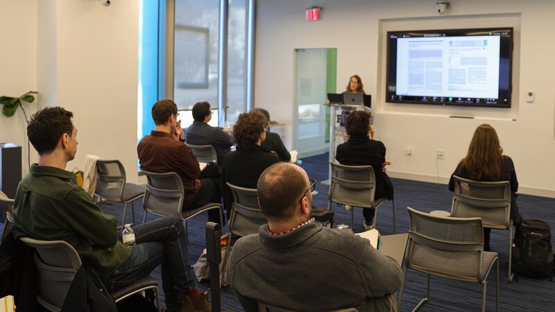 Amy Whitesides presents to an audience of her cohort members and guest advisors