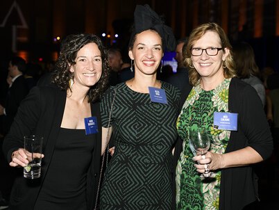 Three women smile at LAF's Annual Benefit