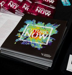 image of a black poster with heat-map topographic image with the words Future Now
